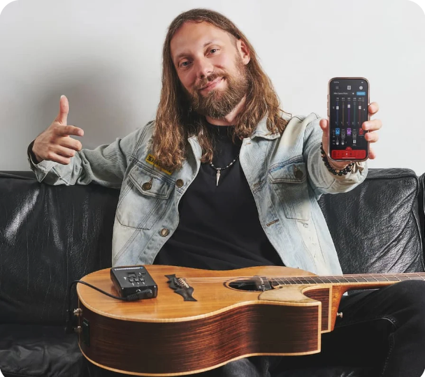 Guitarist playing with the ToneWoodAmp2
