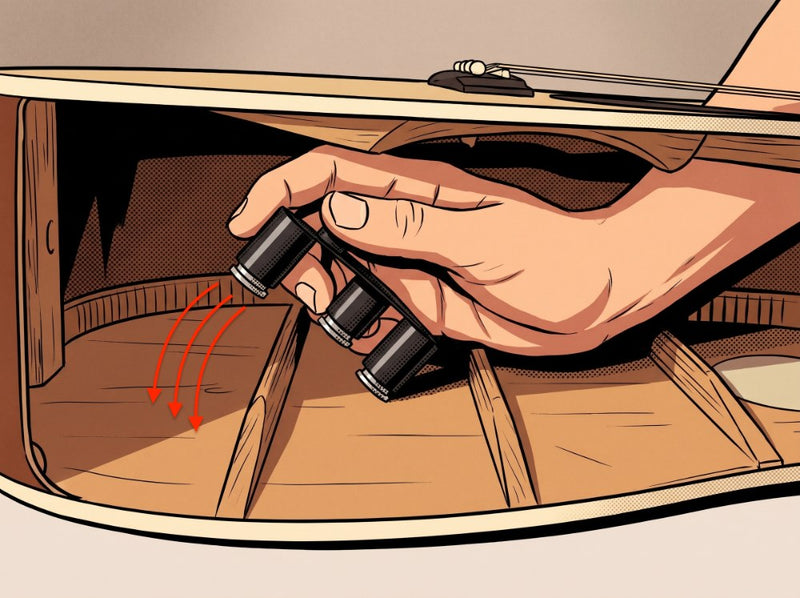 Inserting the X-Brace through the soundhole